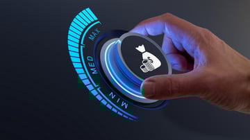 A hand turning up a wage dial from minimum to medium to maximum