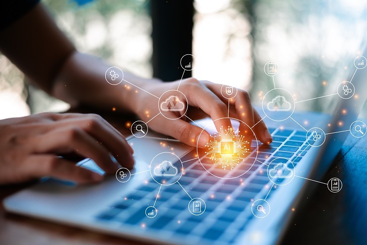 Hands typing on a laptop with glowing digital connection icons rising from the keyboard.