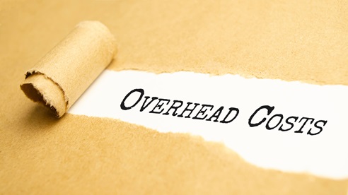 The words Overhead Costs revealed beneath torn brown paper.