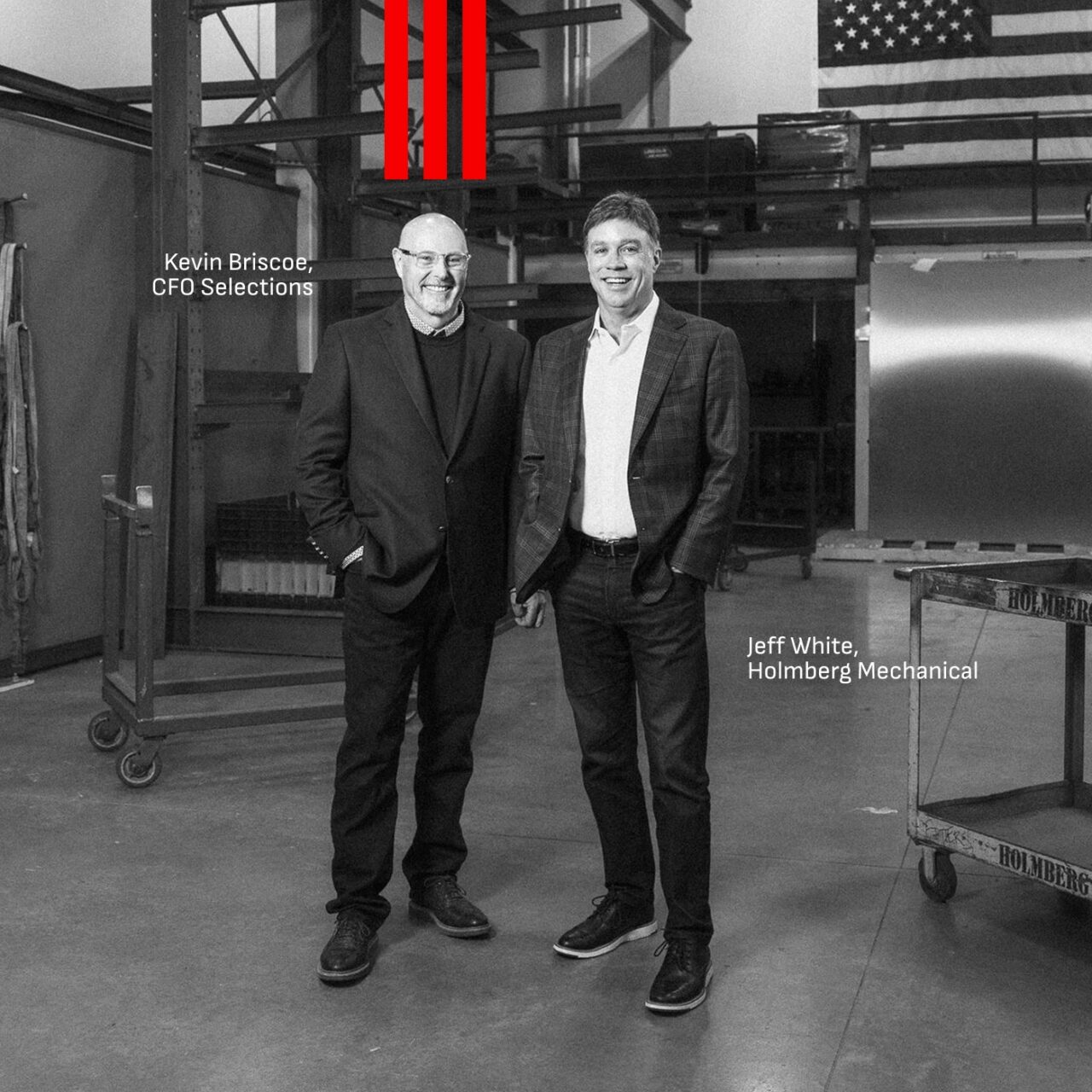 Kevin Briscoe of CFO Selections and Jeff White of Holmberg Mechanical standing in the Holmberg Mechanical fabrication shop