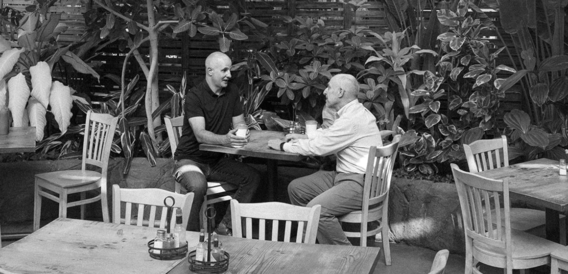 Tom McDowell of CFO Selections and Brian Damron of Swansons Nursery talking over coffee at the nursery cafe.