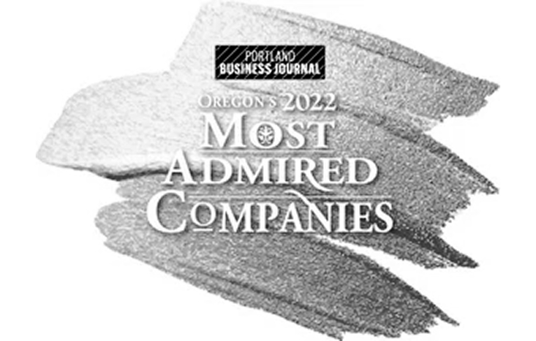 Portland Business Journal Oregon's 2022 Most Admired Companies award logo on a painted brushstroke background.