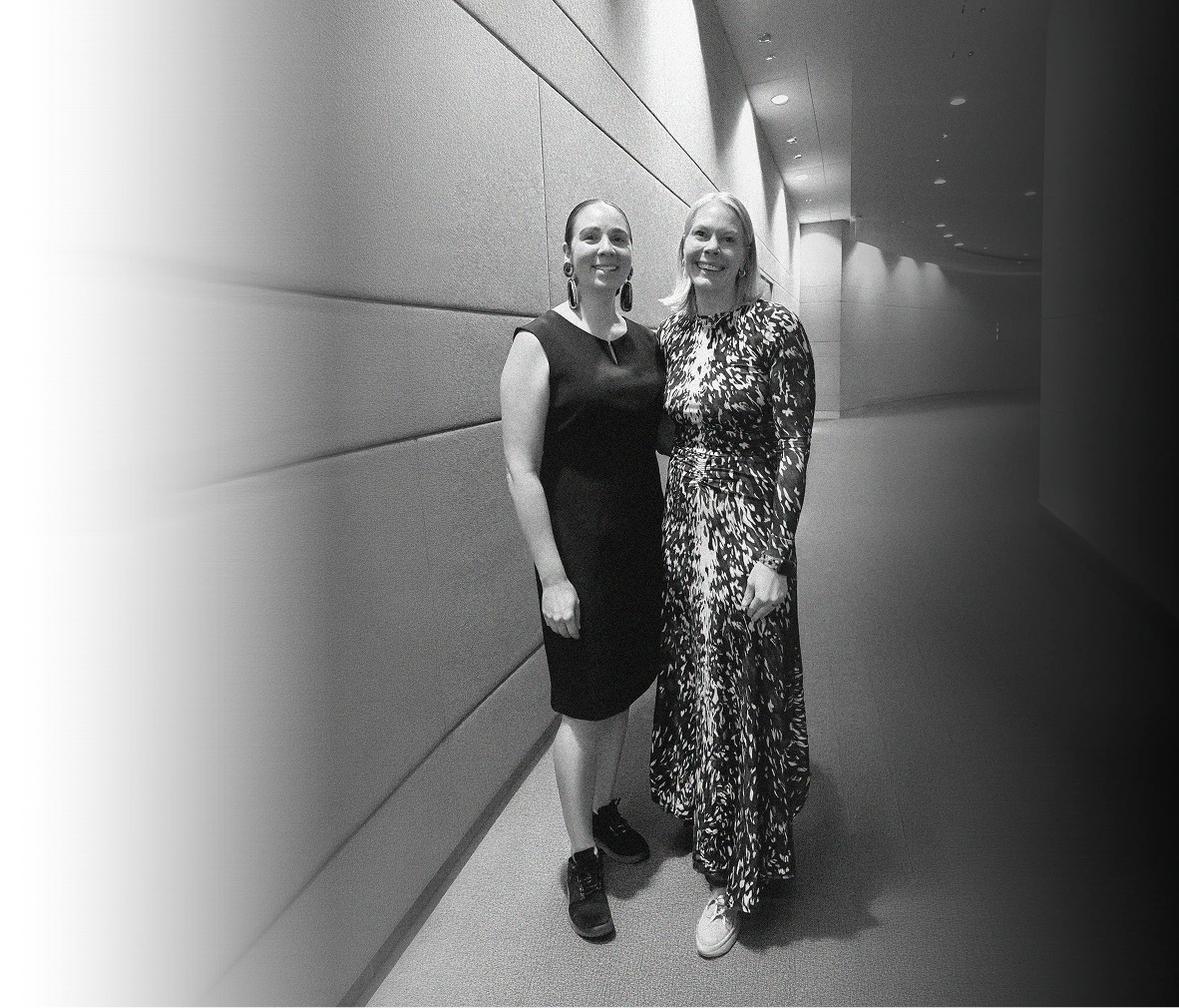 CFO Selections' Rebecca Alderfer stands in a convention center hallway with colleague