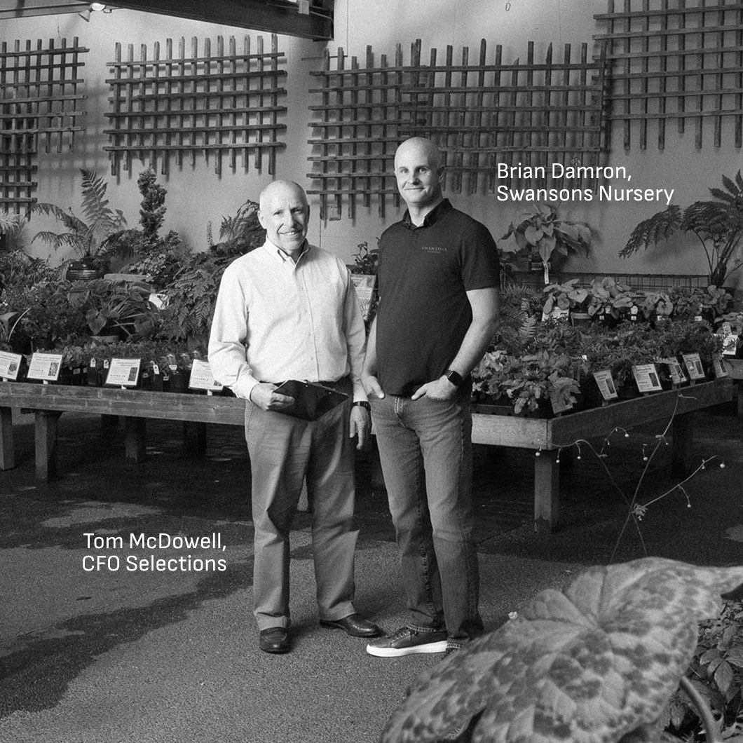 Fractional CFO Tom McDowell and owner Brian Damron among plants at Swansons Nursery